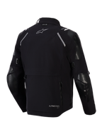 Giacca Alpinestars Andes Pro Drystar® XF, vista posteriore, nero e grigio scuro, giacca adventure touring in tessuto con ampia tasca posteriore, inserti riflettenti sulle spalle, logo Alpinestars e marchio di compatibilità Tech-Air®.