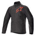 Giacca Alpinestars Hyde XT Drystar XF, giacca tecnica da moto nera e rosso acceso, grande logo a stella rosso sul petto, cerniere di ventilazione verticali sul petto, colletto alto, tessuto elasticizzato in quattro direzioni testurizzato, progettata per la guida adventure e fuoristrada