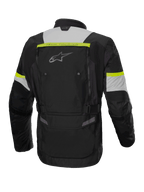 Alpinestars Giacca Bogotá Pro Drystar®, giacca da moto adventure touring da uomo, nero e giallo fluo, in tessuto impermeabile, vista posteriore.
