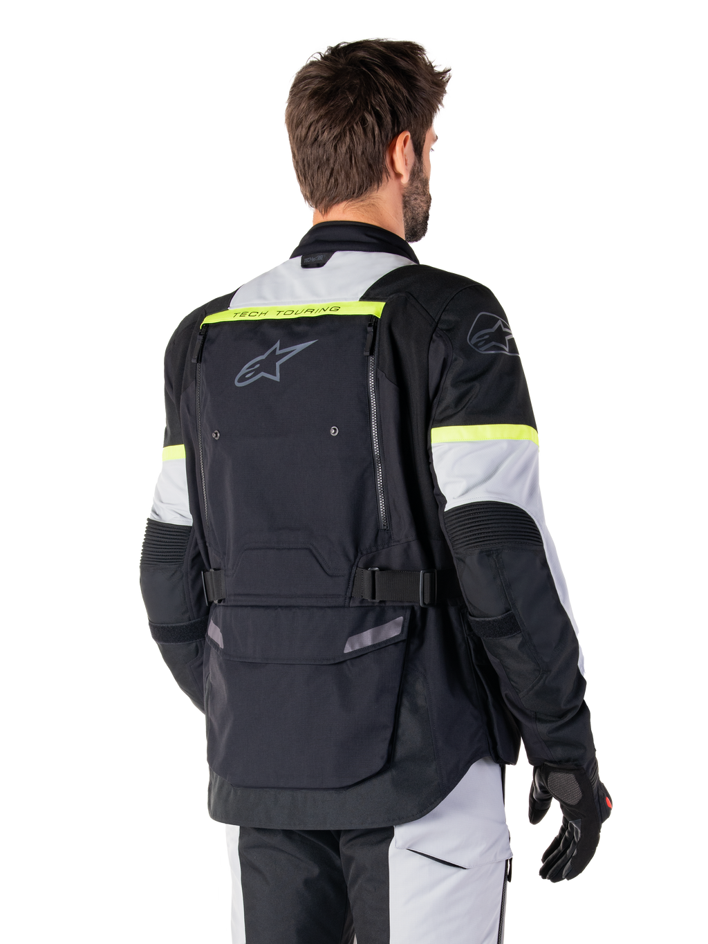 Alpinestars Giacca Bogotá Pro Drystar®, giacca adventure touring, Nero Ice Gray e Giallo Fluo, vista posteriore con ampio pannello tasca posteriore con marchio 'TECH TOURING', logo Alpinestars e accenti fluorescenti, abbigliamento tecnico in tessuto