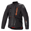 Giacca Alpinestars AMT-10R Drystar XF, nero e arancione, giacca da moto adventure touring, inserti grigi sulle spalle, cerniere multiple con tiranti arancioni, cinghie regolabili, fodera interna rossa, abbigliamento tecnico protettivo