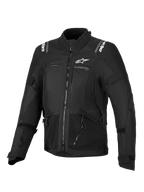 Giacca Alpinestars Stella Andes V4 Drystar®, giacca da moto da donna, nera, vista frontale con loghi bianchi su petto e spalle, design in tessuto multi-pannello con cerniere e dettagli riflettenti, stile adventure-touring
