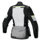 Giacca Alpinestars Stella Andes Air Drystar®, giacca da moto touring da donna, vista posteriore, Grigio Ghiaccio, Grigio Scuro e Nero, caratterizzata da un ampio pannello posteriore in rete bianca, tasca portaoggetti posteriore grigia con logo, dettagli giallo alta visibilità e costruzione in tessuto per flusso d'aria e protezione.