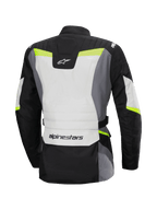 Alpinestars Stella ST-1 Waterproof Jacket, vista posteriore, giacca da moto touring da donna, grigio ghiaccio, nero e giallo fluo, loghi Alpinestars su collo e parte bassa della schiena, design adventure touring con costruzione in tessuto e dettagli fluorescenti