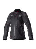 Alpinestars Stella Bogota Pro Drystar Jacket da donna, giacca da moto adventure touring nera, costruzione in tessuto impermeabile con cerniere anteriori multiple e pannelli di ventilazione, cinghie regolabili su maniche e vita, sottili accenti rossi e marchio Alpinestars.