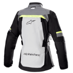Giacca Alpinestars Stella Bogota' Pro Drystar® da donna, vista posteriore, grigio ghiaccio e grigio scuro con accenti giallo fluorescente, grande logo sulla schiena, scritta 'Tech Touring', cerniere di ventilazione verticali e pannelli a soffietto rinforzati sui gomiti