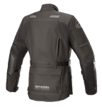 Giacca Alpinestars Stella Andes V3 Drystar® da donna, nero e grigio scuro, vista posteriore con costruzione in tessuto impermeabile, ampia tasca porta-attrezzi sul fondo schiena, cintura regolabile in vita e dettagli riflettenti di sicurezza.
