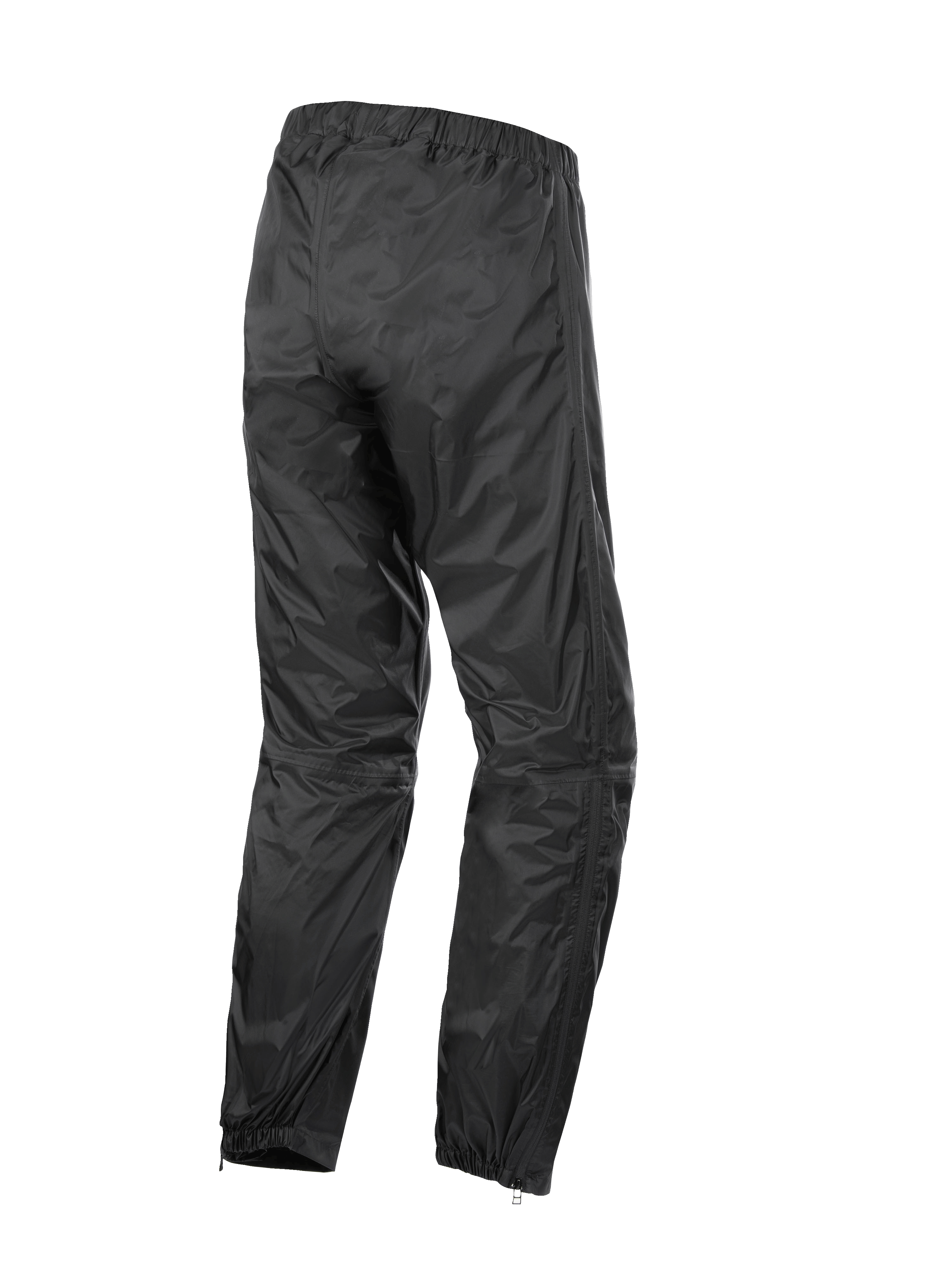 Alpinestars Hurricane Rain V2 Pant, sovrapantaloni da moto impermeabili, nero, vista posteriore con fascia elastica in vita e polsini, tessuto laminato leggero e antivento con cerniere a fondo gamba per calzare facilmente gli stivali, abbigliamento protettivo per touring su strada e adventure