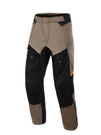 Alpinestars Cusco Drystar® Pants, pantaloni da moto adventure Walnut Black, vista frontale, con pannelli marrone noce e neri con accenti arancioni, ampie ventilazioni con zip sulle cosce e robusta costruzione in tessuto.