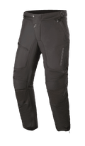 Alpinestars Raider V2 Drystar® Pants, pantaloni da moto touring neri, struttura in tessuto impermeabile con pannelli a fisarmonica sulle ginocchia, tasche con zip e vita regolabile, design resistente per la guida su strada in ogni condizione climatica