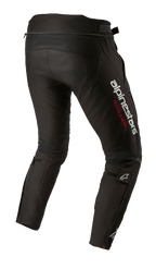 Pantaloni Alpinestars T-SP R Drystar®, pantaloni da moto in tessuto nero, vista posteriore a tre quarti con grande logo Alpinestars bianco e scritta 'RACING AHEAD' in rosso sulla coscia, cerniere alle caviglie e cinturini regolabili sui polpacci.