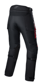 Alpinestars Pantaloni Honda Bogota' Pro Drystar®, pantaloni da moto touring adventure, neri con marchio HONDA rosso, vista posteriore con pannelli elastici a fisarmonica in vita, cinturini regolabili sui polpacci e struttura in tessuto resistente per la guida adventure multi-stagione.