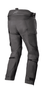 Alpinestars Bogota' Pro Drystar® 4 Seasons Pants - Short, pantaloni da moto adventure touring, nero, vista posteriore con vita alta e logo, pannello a fisarmonica elasticizzato, cinghie regolabili sui polpacci e costruzione in tessuto tecnico.