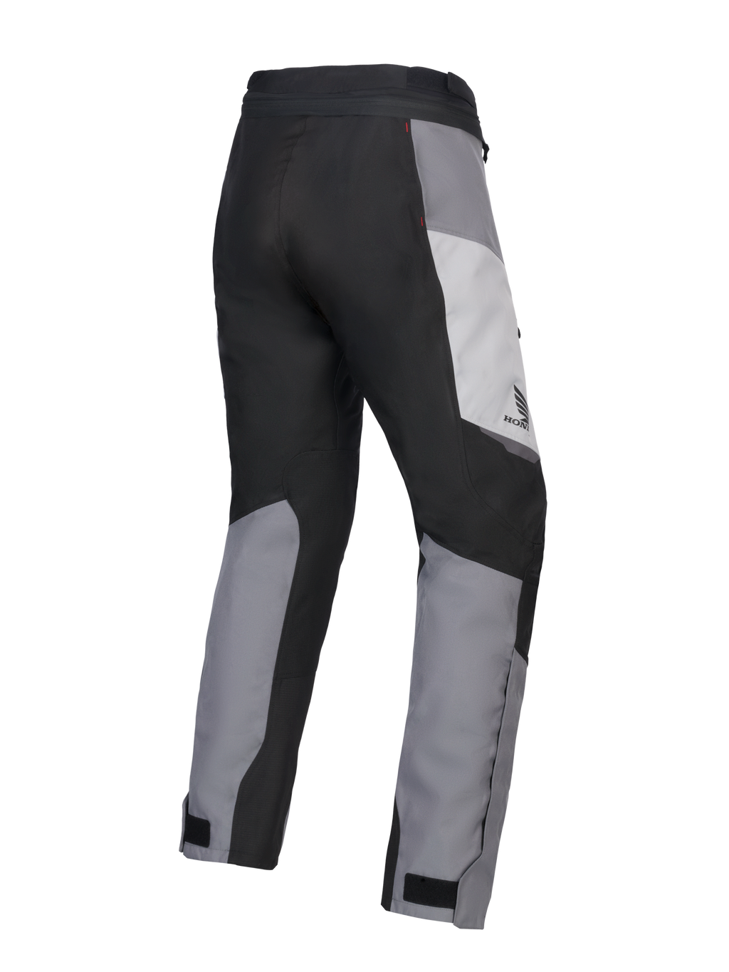 Alpinestars 2025 Honda Stella ST-1 Waterproof Pants, pantaloni da moto touring da donna, Ice Gray, Grigio Scuro e Nero, vista posteriore a tre quarti che mostra la costruzione in tessuto resistente, pannelli color-block grigi e neri, marchio Honda sul fianco e chiusure regolabili alle caviglie.