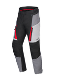 Alpinestars Honda Stella ST-1 Waterproof Pants, pantaloni da moto touring da donna, grigio ghiaccio, grigio scuro e nero con accenti rossi, con tasche cargo con cerniera, costruzione tessile ergonomica e vita regolabile.