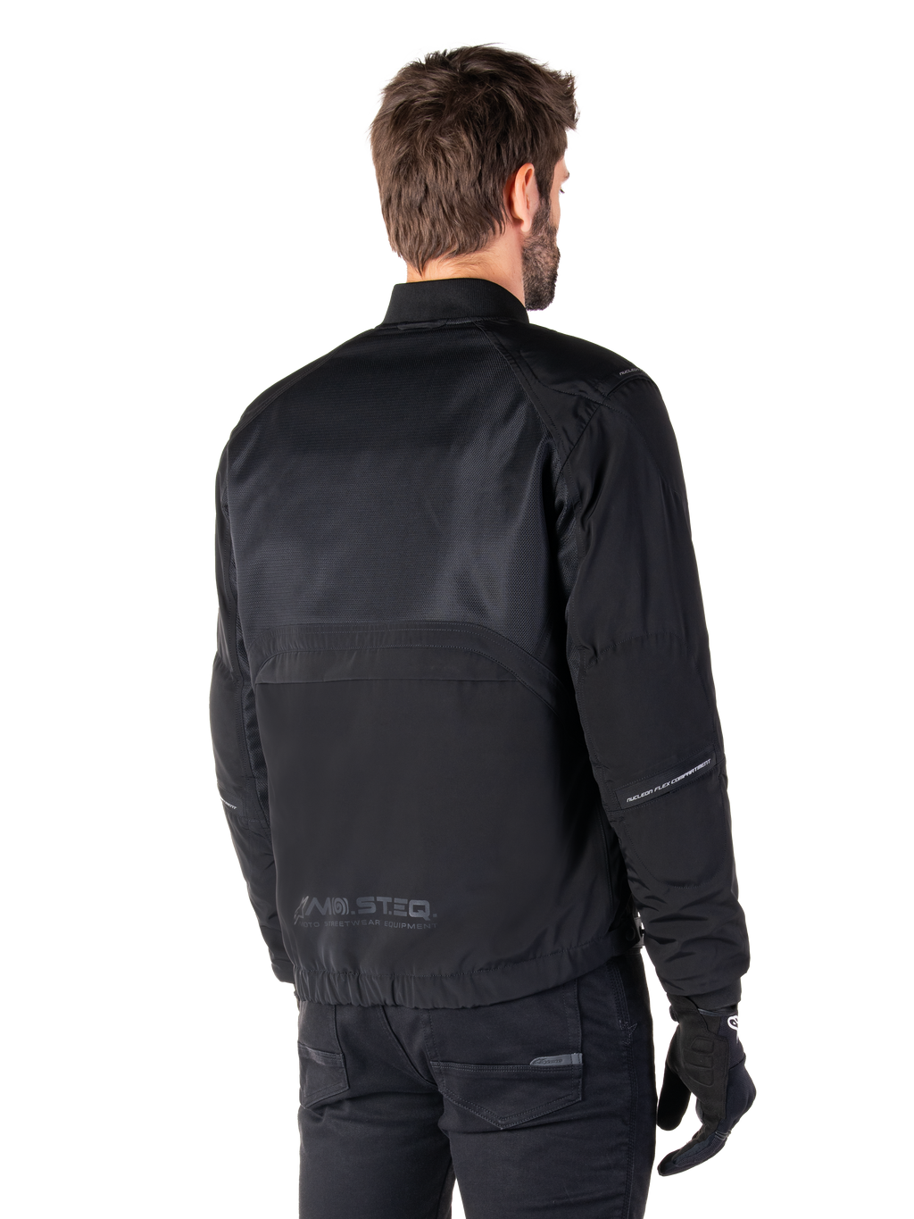 Alpinestars Mootant Waterproof Parka, giacca da moto nera, vista posteriore, con pannelli superiori in mesh e marchio MO.ST.EQ. Moto Streetwear Equipment, design urban contemporaneo per la guida su strada