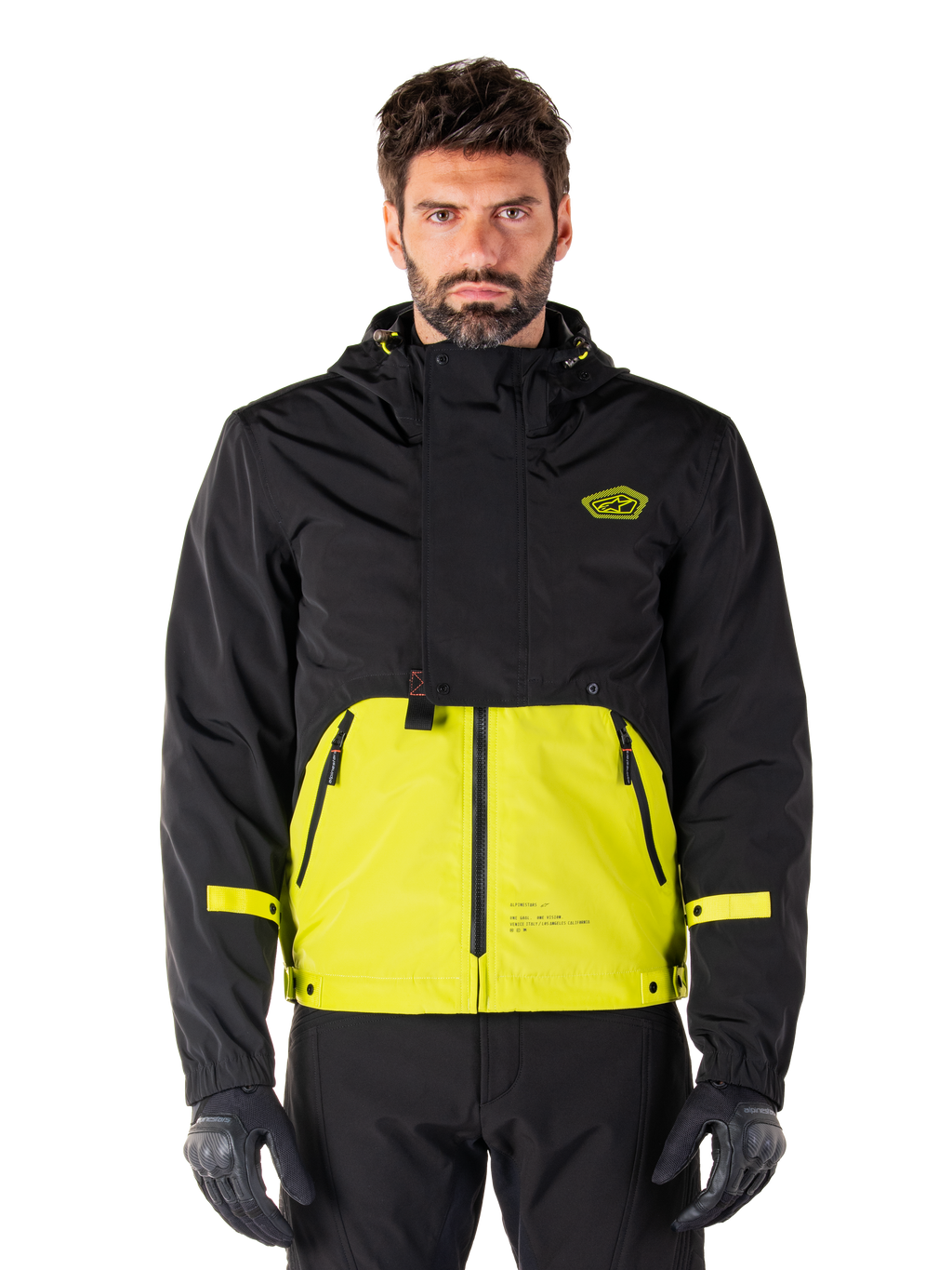 Alpinestars Mootant Waterproof Parka, giacca da moto touring, Lime Punch e nero, design bicolore con cappuccio, parte inferiore giallo brillante e parte superiore nera, cinturini gialli sulle maniche, logo sul petto, stile tecnico modulare