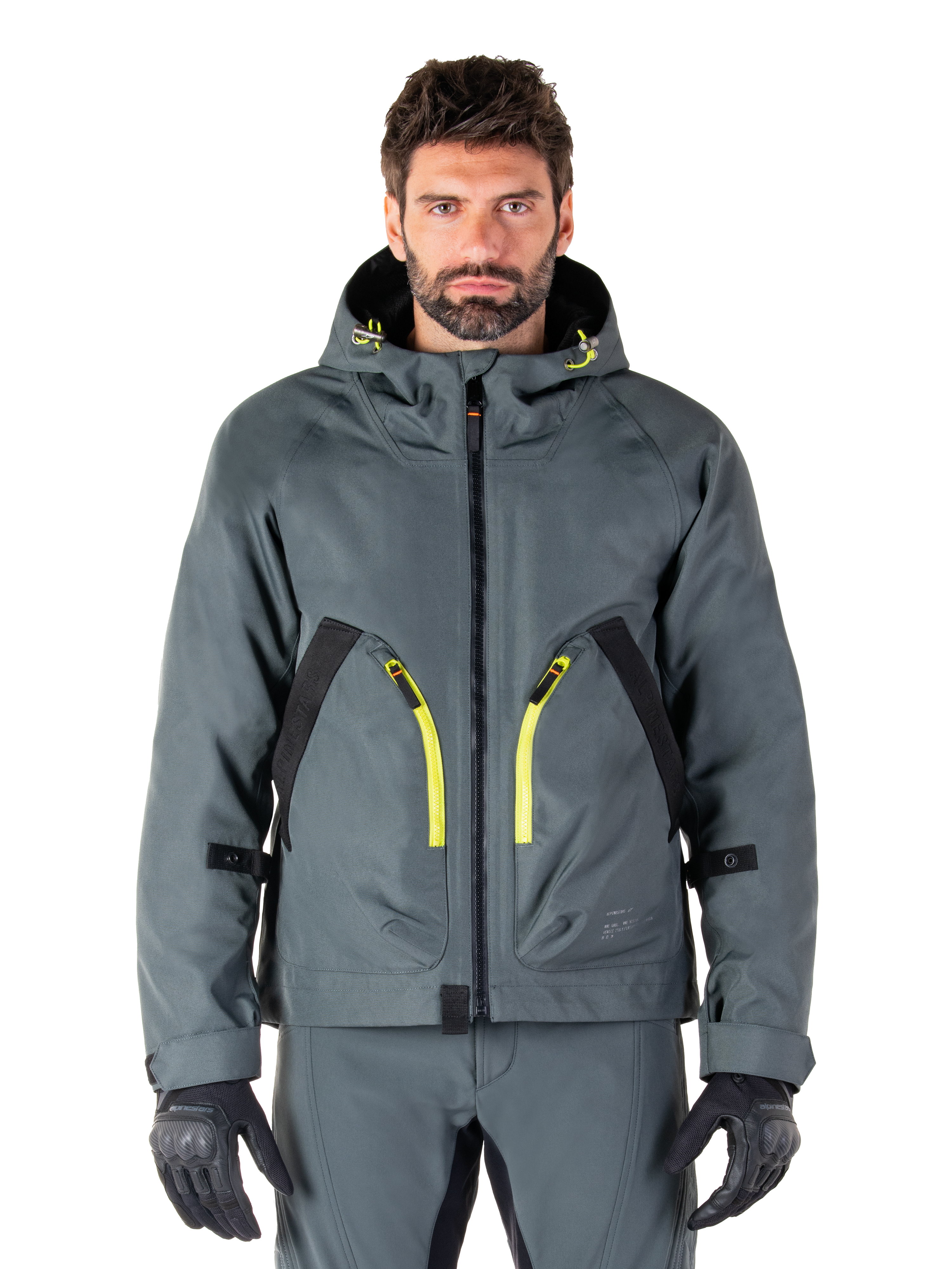Alpinestars Morush Waterproof Parka, giacca da moto grigio urbano, cerniere giallo vivace e dettagli neri, design con cappuccio e ampie tasche anteriori, stile tecnico ispirato allo streetwear