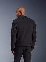 Giacca Alpinestars Bruiser, giacca da moto urbana nera, vista posteriore, caratterizzata da un design d'ispirazione workwear con un piccolo logo dorato sul colletto e cinturini regolabili in vita, robusta costruzione in tessuto per la guida urbana