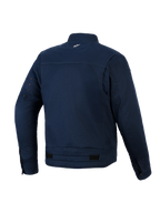 Giacca Alpinestars Bruiser, giacca da moto urbana, blu scuro, vista posteriore con costruzione in twill di policotone elasticizzato, piccolo logo bianco sul retro del collo, occhielli di ventilazione sulle maniche e linguette di regolazione in vita.