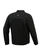 Giacca Alpinestars Provoke, giacca da moto in tessuto, nera, vista posteriore con pannelli in softshell ripstop e un piccolo logo bianco sulla parte superiore della schiena, design tecnico urbano per il pendolarismo in moto
