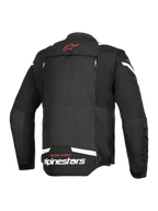 Alpinestars T-Stunt Air Jacket, vista posteriore, nero e bianco, con logo a stella rosso sul collo, marchio bianco sulla parte inferiore della schiena e cerniere verticali per il sistema modulare di flusso d'aria.