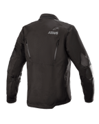 Giacca Alpinestars Venture XT, nera, vista posteriore di una giacca da moto adventure touring in tessuto, con logo ASTARS sulla spalla, cerniere di ventilazione verticali sulla schiena e rinforzi in pellicola PU sulle braccia