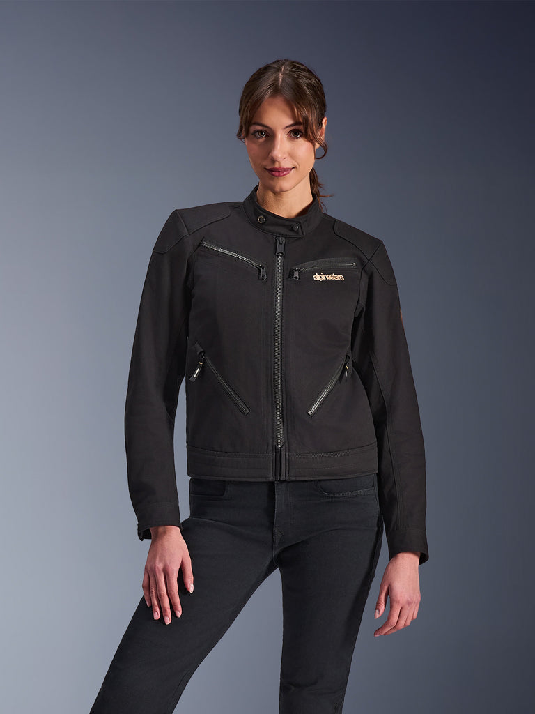 Alpinestars Stella Grace Jacket, giacca da moto da donna, nera con zip metalliche e logo dorato sul petto, colletto alto, tasche con zip verticali, design moderno e sportivo