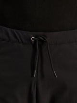 Alpinestars Pantaloni Aeroshell Airflow, Nero, primo piano della vita con cordoncino elastico interno regolabile e dettaglio dell'occhiello argentato, abbigliamento moto sport-touring