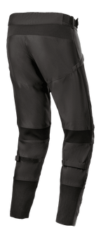 Alpinestars T SP-5 Rideknit® Pants, pantaloni da moto in tessuto, nero, vista posteriore che evidenzia il profilo posteriore alto e la vestibilità affusolata, pannelli elasticizzati con tecnologia a maglia dietro le ginocchia e sulle caviglie, cinturini regolabili sui polpacci, abbigliamento tecnico per guida su strada