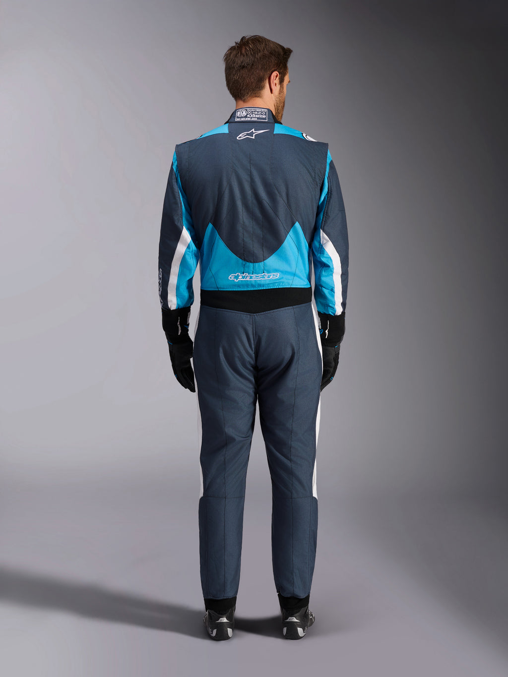 Alpinestars Tuta GP Pro Comp V2 FIA, tuta da corsa auto uomo, grigio e ciano, vista posteriore, protezione certificata FIA.