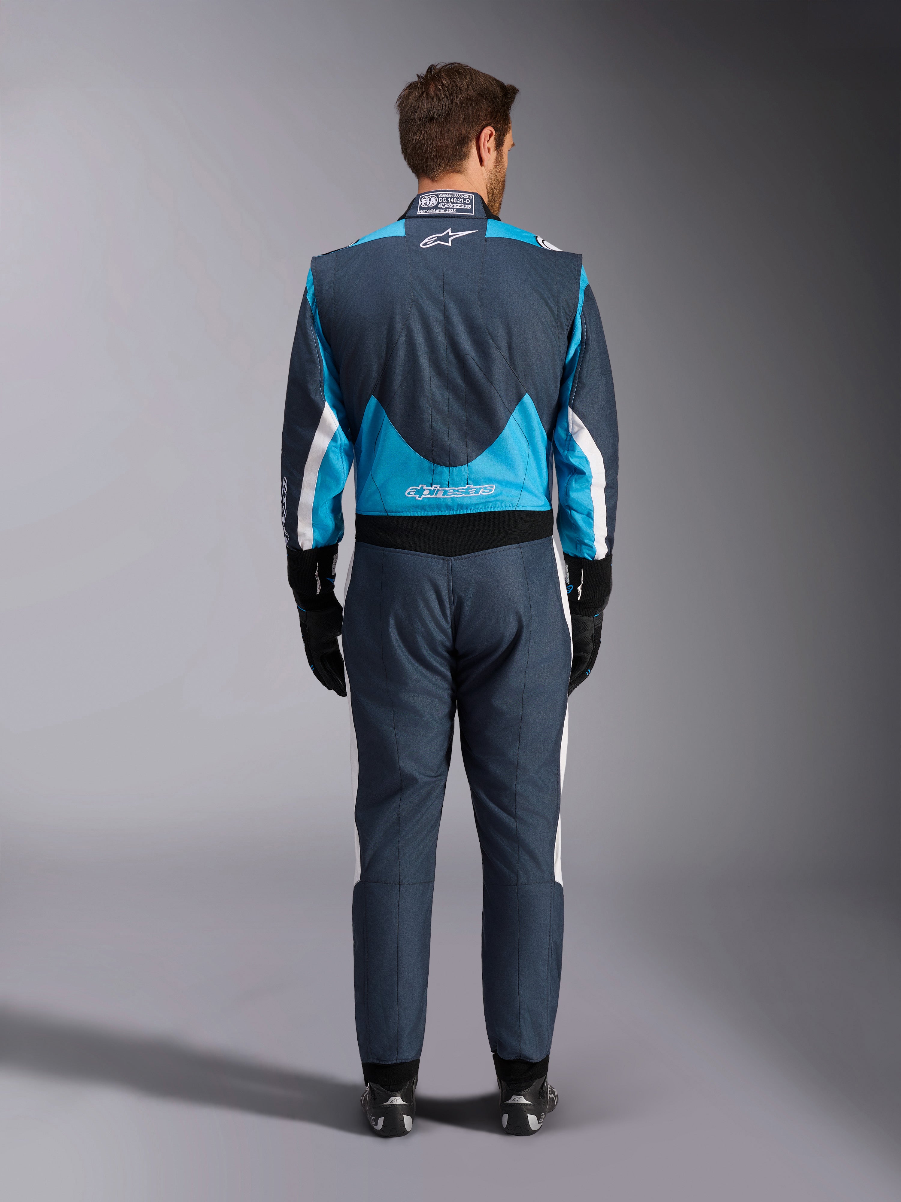 Alpinestars Tuta GP Pro Comp V2 FIA, tuta da corsa auto uomo, grigio e ciano, vista posteriore, protezione certificata FIA.