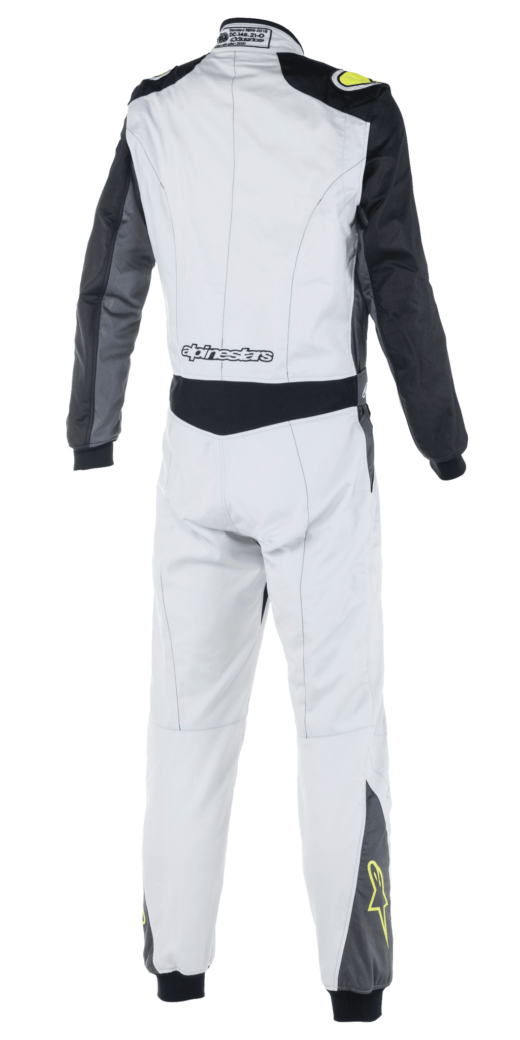 Tuta Alpinestars Atom FIA, tuta da corsa auto, argento, antracite e giallo fluo, vista posteriore con maniche nere e pannello in vita, marchio Alpinestars sulla parte bassa della schiena, loghi a stella gialli sulla parte inferiore delle gambe, abbigliamento da motorsport certificato FIA