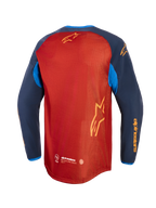 Alpinestars Maxdura Dual Jersey, maglia da moto adventure, marrone ruggine e Mood Indigo con accenti blu brillante, vista posteriore che mostra il torso completamente in rete, orlo posteriore allungato e logo Alpinestars giallo sulle maniche e sul retro