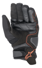 Guanti Alpinestars SMX-1 Drystar®, guanti da moto, nero e rosso fluo, vista del palmo che evidenzia la costruzione in pelle e camoscio rinforzati, zone di atterraggio imbottite e cinturino in Velcro con logo a stella rosso
