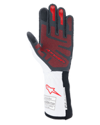 Guanti Alpinestars Tech-1 ZX V4, guanti auto, nero, bianco e rosso, vista del palmo con motivo grip in silicone 3D rosso, polsino bianco con logo Alpinestars rosso ed etichette di certificazione FIA e SFI