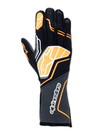 Guanti Alpinestars Tech-1 ZX V4, guanti da auto racing, nero con dettagli arancione fluo e bianchi, grande logo grafico sul dorso, tessuto con trama a nido d'ape sul polsino, design geometrico sportivo per competizioni professionistiche