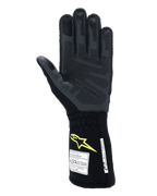 Guanti Alpinestars Tech-1 ZX V4, guanti da gara auto, Tar Gray e nero con logo giallo fluo, vista del palmo con grip in silicone 3D testurizzato e etichette di certificazione di sicurezza FIA/SFI, equipaggiamento professionale per motorsport