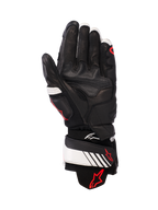 Guanti in pelle Alpinestars GP Plus R v3, nero, bianco e rosso fluo, vista del palmo che mostra la struttura interamente in pelle con imbottitura rinforzata, cinturino bianco sul polso con logo Alpinestars rosso, equipaggiamento protettivo di ispirazione racing per motociclisti