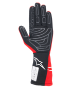 Guanti Alpinestars Tech-1 Start V4 FIA, guanti per corse automobilistiche, rosso e nero, vista del palmo con motivi in silicone grigio per il grip, logo Alpinestars bianco sul polsino allungato ed etichetta di certificazione FIA 8856-2018