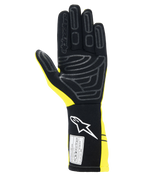 Alpinestars Tech-1 Start V4 Gloves FIA, guanti da corsa auto, giallo fluo e nero, vista del palmo con motivi in silicone per il grip, polsino allungato con logo bianco ed etichetta di certificazione FIA