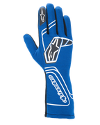 Guanti Alpinestars Tech-1 Start V4 FIA, guanti da corsa automobilistica, blu Royal, con branding geometrico bianco e loghi a stella neri, polsino allungato con scritta Alpinestars in verticale, elegante struttura senza cuciture per prestazioni leggere, attrezzatura da corsa professionale certificata FIA
