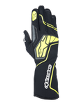 Guanti Alpinestars Tech-1 KX V4, guanti da karting, grigio tar, nero e giallo fluo, vista del dorso con struttura in mesh traspirante, grande logo Alpinestars giallo, scritta bianca sul polso, stella gialla sull'indice, design sportivo moderno