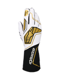 Alpinestars Tech-1 KX V4, guanti da karting, bianco e nero con accenti oro, con logo a stella dorato sull'indice e ampi motivi geometrici oro sul dorso, struttura in mesh traspirante con polsino nero e branding bianco, design ergonomico per prestazioni motorsport
