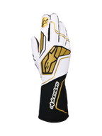 Alpinestars Tech-1 KX V4, guanti da karting, bianco e nero con accenti oro, con logo a stella dorato sull'indice e ampi motivi geometrici oro sul dorso, struttura in mesh traspirante con polsino nero e branding bianco, design ergonomico per prestazioni motorsport