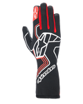 Guanti Alpinestars Tech-1 Race V4, guanti da corsa per auto, nero con dettagli rossi e bianchi, grande logo a stella bianco sul dorso, soffietti delle dita rossi, marchio bianco sul polsino lungo, motivi geometrici