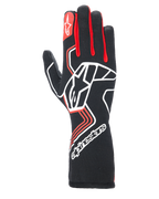 Guanti Alpinestars Tech-1 Race V4, guanti da corsa per auto, nero con dettagli rossi e bianchi, grande logo a stella bianco sul dorso, soffietti delle dita rossi, marchio bianco sul polsino lungo, motivi geometrici