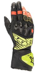 Guanti Alpinestars GP Tech V2, guanti da moto racing, nero con accenti giallo fluo e rossi, con protezione rigida per le nocche, polsino in pelle traforata con marchio DFS e pannelli elasticizzati a soffietto per una flessibilità ottimale.