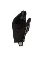Guanti Alpinestars Pro-Dura 2026, nero grigio, vista del palmo in scamosciato sintetico e grip in silicone a nido d'ape sulle dita, con testo 'ONE GOAL. ONE VISION.' e logo a spirale bianco sulla linguetta, attrezzatura resistente per motociclismo fuoristrada