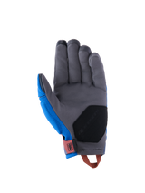 Guanti Alpinestars Durack, guanti da moto adventure, blu reale e grigio scuro, vista del palmo con struttura in pelle scamosciata sintetica grigia, imbottitura di rinforzo nera sulla base del palmo, linguetta del polso rossa e asola di trazione arancione.
